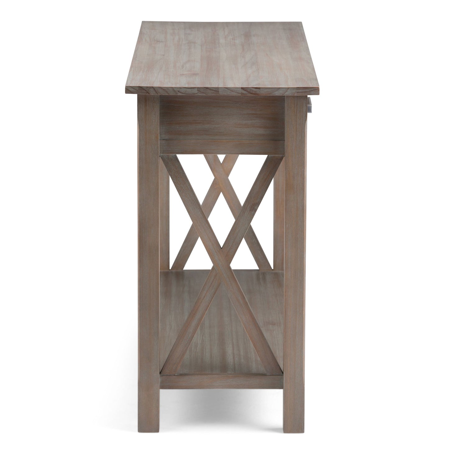 Side view of the Kitchener - Handcrafted Table featuring a rectangular top, open bottom shelf, X-shaped side braces, and a light weathered wood finish.
