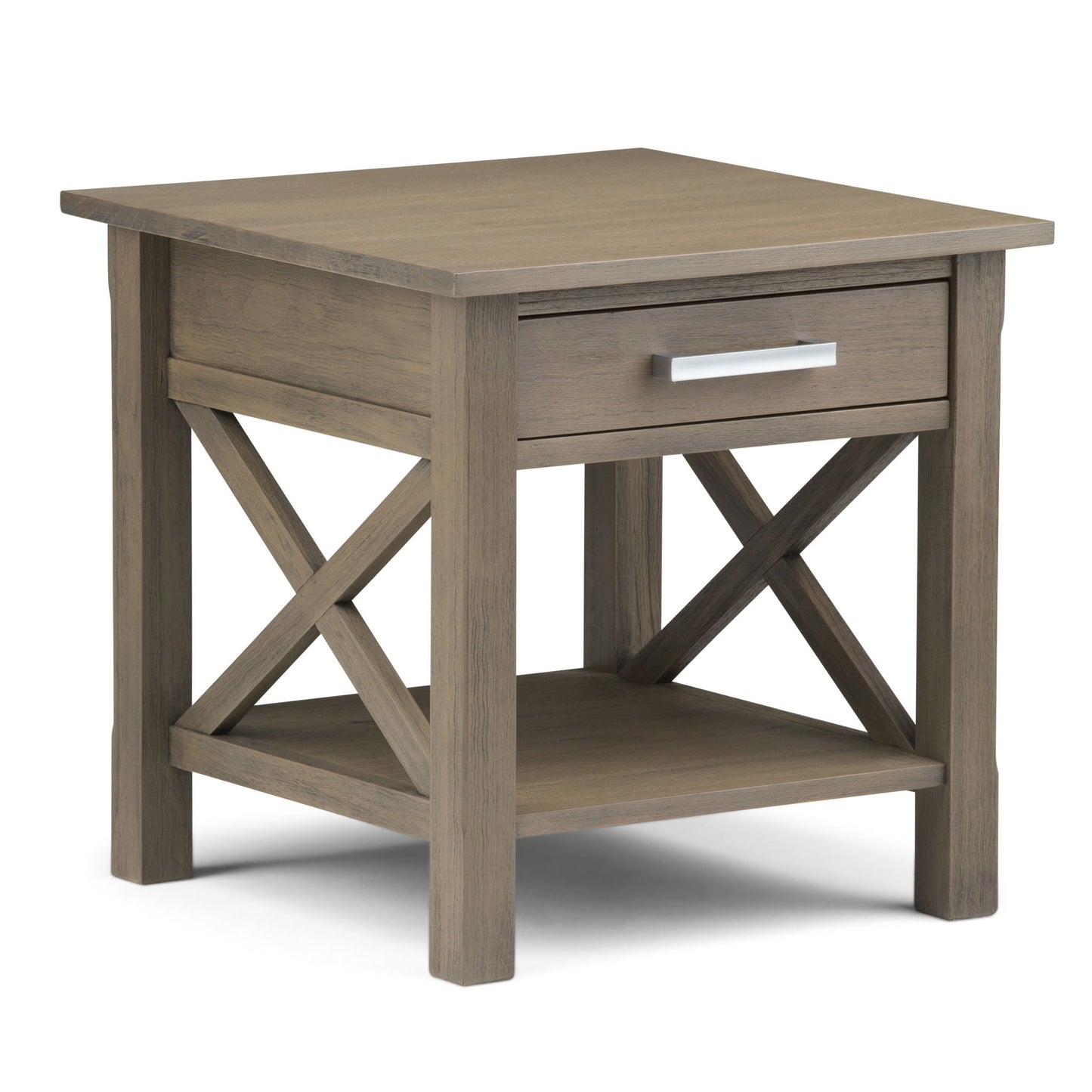 The Kitchener - Handcrafted Table is a wooden end table in light brown, featuring one drawer with a silver handle, X-shaped side supports, and a lower shelf for extra storage.
