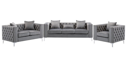The Lorreto Velvet Fabric Living Room Set is a three-piece gray ensemble with tufted backs and silver legs, including a sofa, loveseat, and armchair, each featuring matching accent pillows.