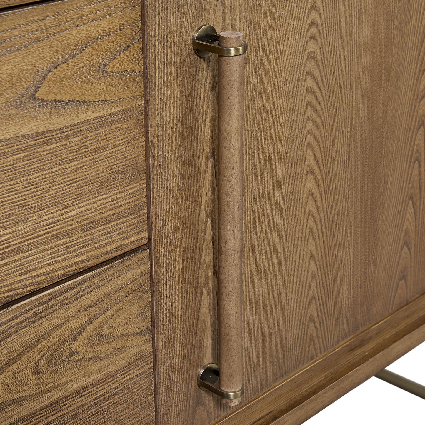 Close-up of the Metal Base Sideboard - Light Brown, showing a vertical cylindrical wooden handle with brass accents, a right-side door, and left-side drawers highlighting the natural wood grain pattern.