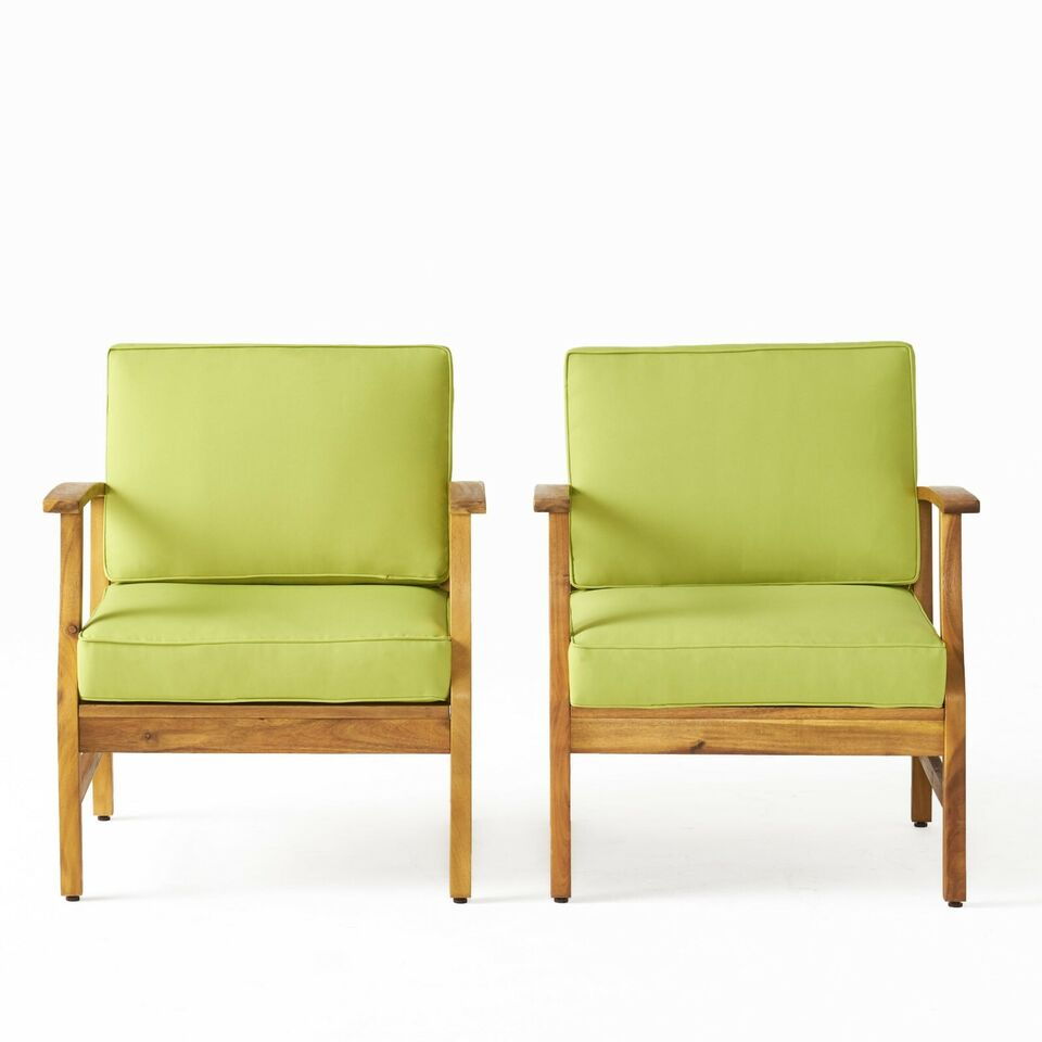 Two Perla Contemporary Club Chairs with water-resistant light green cushions are placed side by side on a plain white background. The chairs showcase simple, straight lines and a modern design.