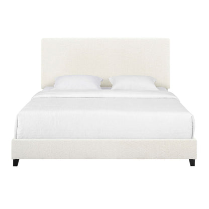 A front view of the Upholstered Platform Bed featuring a tall upholstered headboard, white bedding with two pillows, and black legs, all set against a plain white background.