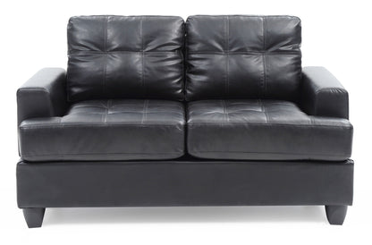The Stylish Transitional Loveseat For Two features modern black leather, tufted cushions, wide armrests, and short black legs, shown against a white background.