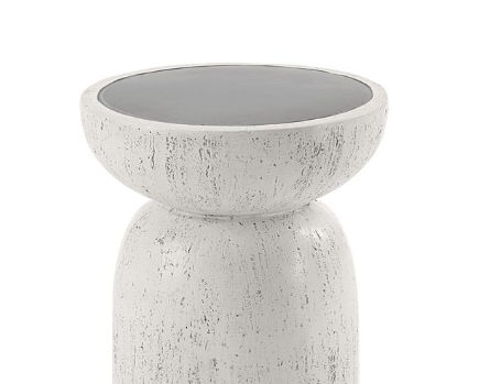 The Dylana Natural Fiber Concrete Accent Table features a modern round design with a textured white base and a smooth dark gray, bowl-like top resting on a rounded cylindrical pedestal.