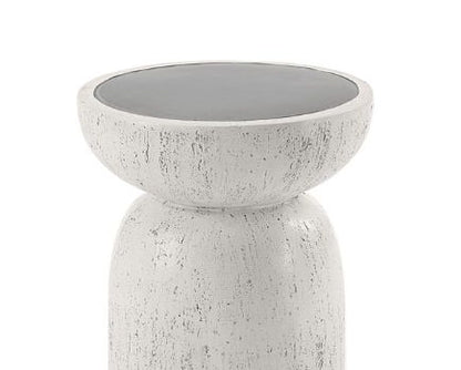 The Dylana Natural Fiber Concrete Accent Table features a modern round design with a textured white base and a smooth dark gray, bowl-like top resting on a rounded cylindrical pedestal.