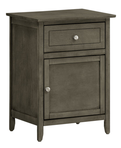 The Izzy 1 Drawer/1 Door Nightstand features a simple rectangular design, a muted gray-brown finish, and round metal knobs on both the single drawer and cabinet door.