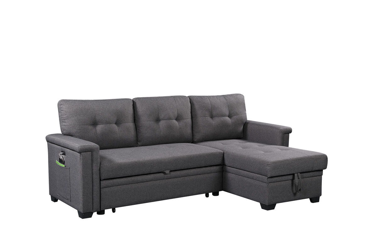 The Nathan Reversible Sleeper Sectional Sofa features a modern dark gray design, tufted cushions, storage chaise, USB charging ports, a left armrest pocket, and short black legs for a clean look.