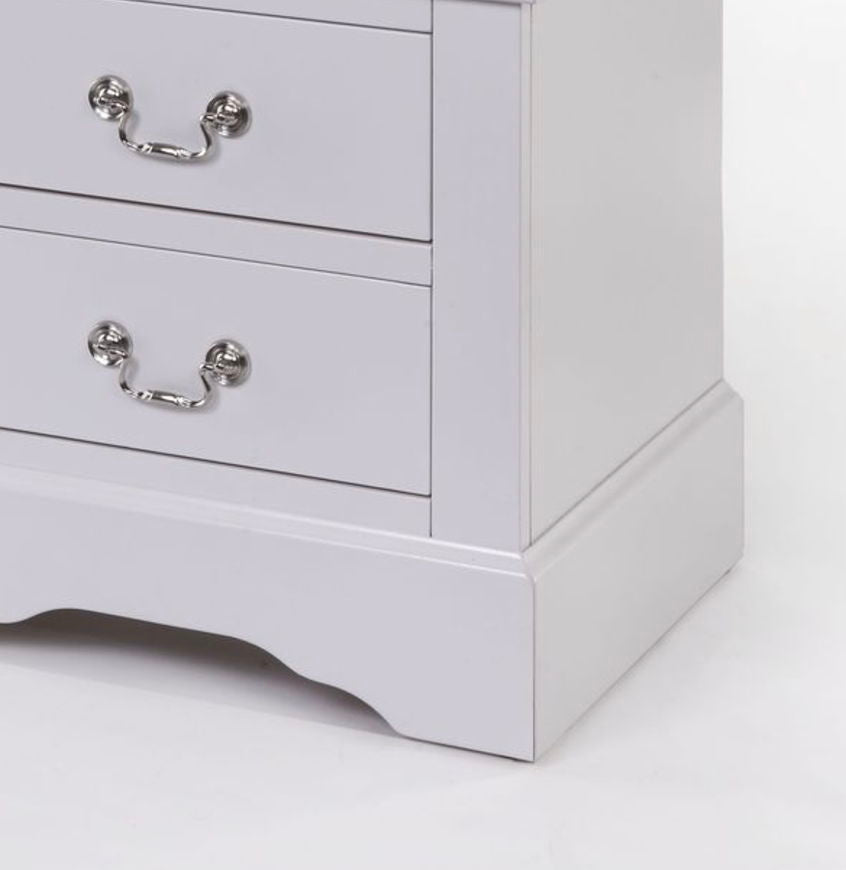 A close-up of the Louis Philippe III Sleek Design Nightstand shows its white wooden finish, silver metal handles on two drawers, and a decorative scalloped base.