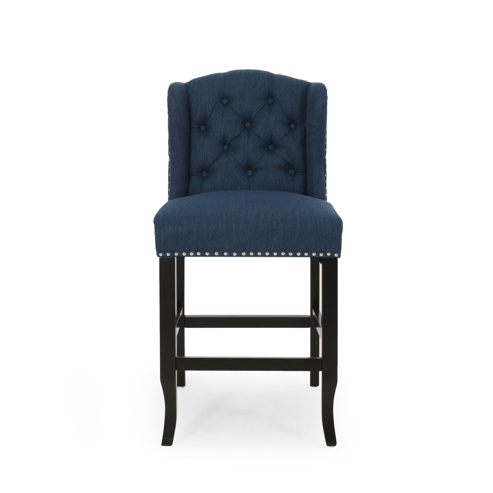 The Vienna - Fabric Tufted Counter Stool With Nailhead Accents (Set of 2) features navy blue upholstery, a tufted backrest, silver nailhead trim, and black wooden legs with a footrest, displayed against a white background.