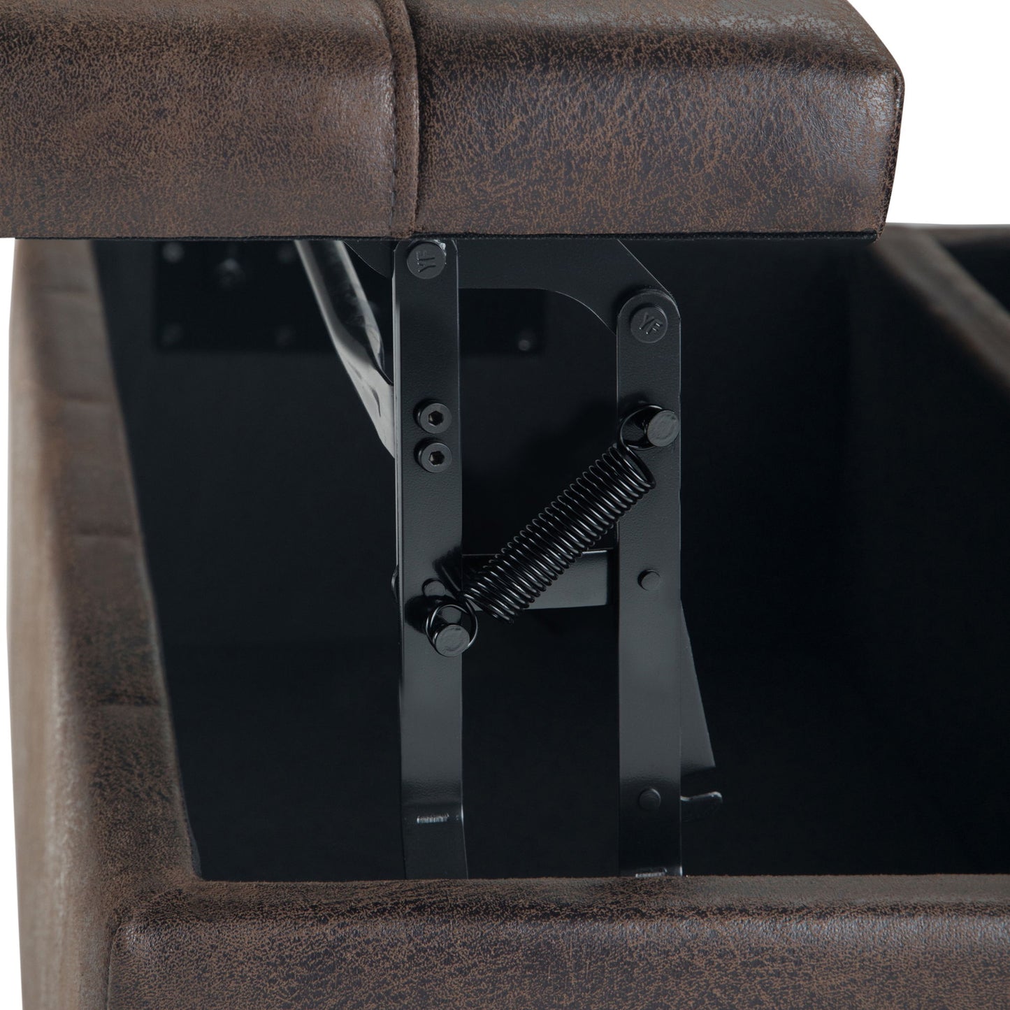 Close-up of the Harrison Large Coffee Table Storage Ottoman in brown faux leather, with the lid open to reveal the black metal hinge and spring mechanism inside the compartment.