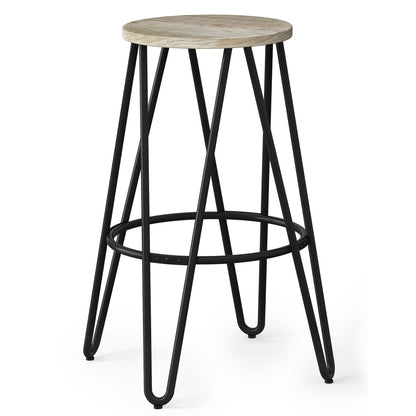 The Simeon is a multifunctional metal stool with a round wooden seat, black legs, and footrest, showcasing a geometric minimalist design.