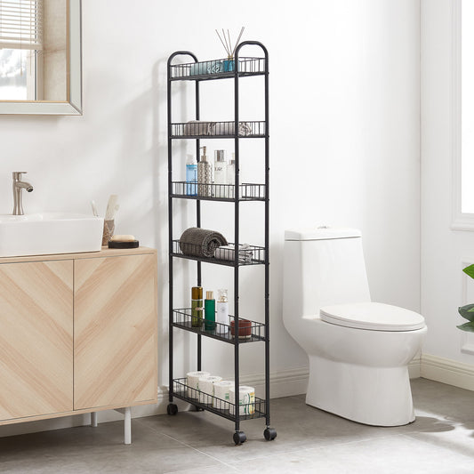 A black 6-tier rolling cart with baskets stands between a light wood bathroom vanity and a white toilet, organizing towels, toiletries, and decor in a bright modern bathroom.