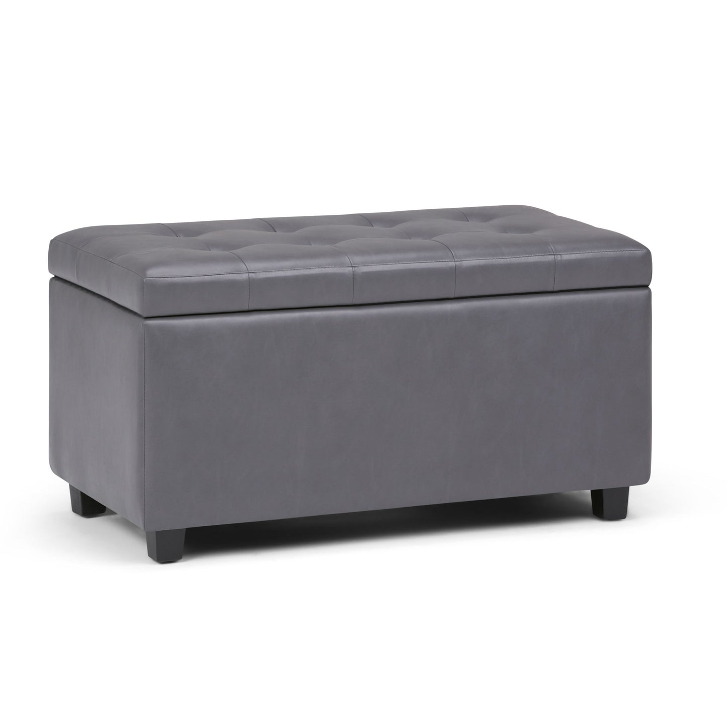The Cosmopolitan Upholstered Storage Ottoman is rectangular, features a tufted dark gray faux leather design with short black legs, and has a hinged top that lifts for convenient storage inside.