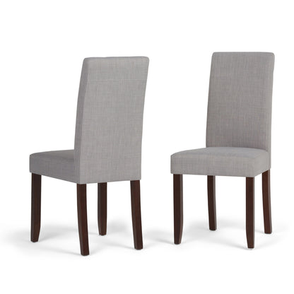Set of 2 Acadian Upholstered Parson Dining Chairs featuring light gray fabric and dark wooden legs, displayed from front and back angles against a white background.