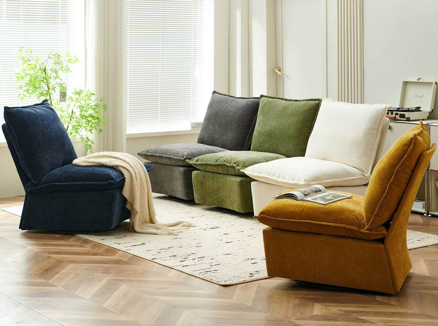 A modern living room with a Detachable Chenille Single 360 Swivel Rocking Rocker, a curved sectional with navy, gray, green, and white cushions, a mustard chair, beige rug, large sunlit windows with blinds, plus a plant and record player.