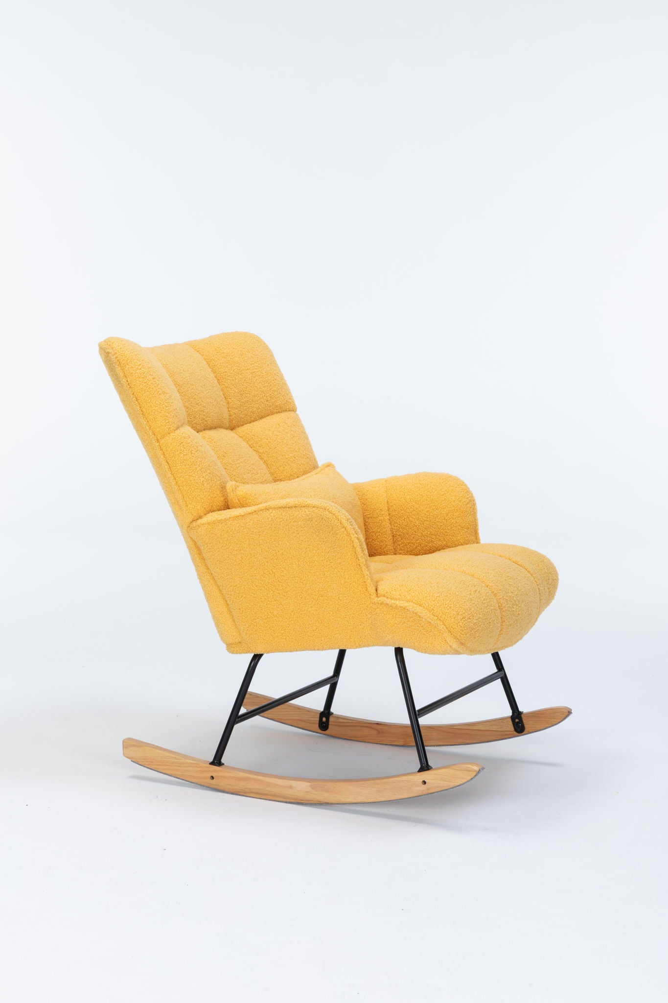 The Rocking Chair Nursery is a modern yellow teddy upholstered glider rocker with a high tufted backrest, black metal frame, and light wooden rockers, shown against a plain white background.