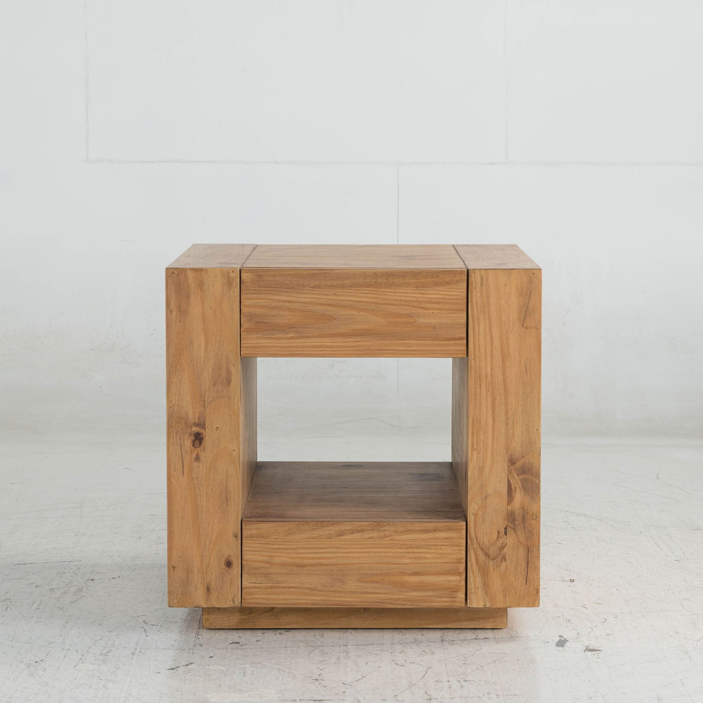 The Harlan End Table in oak features a modern rectangular design with a hollow center, flat top, and lower shelf, shown against a plain white background.