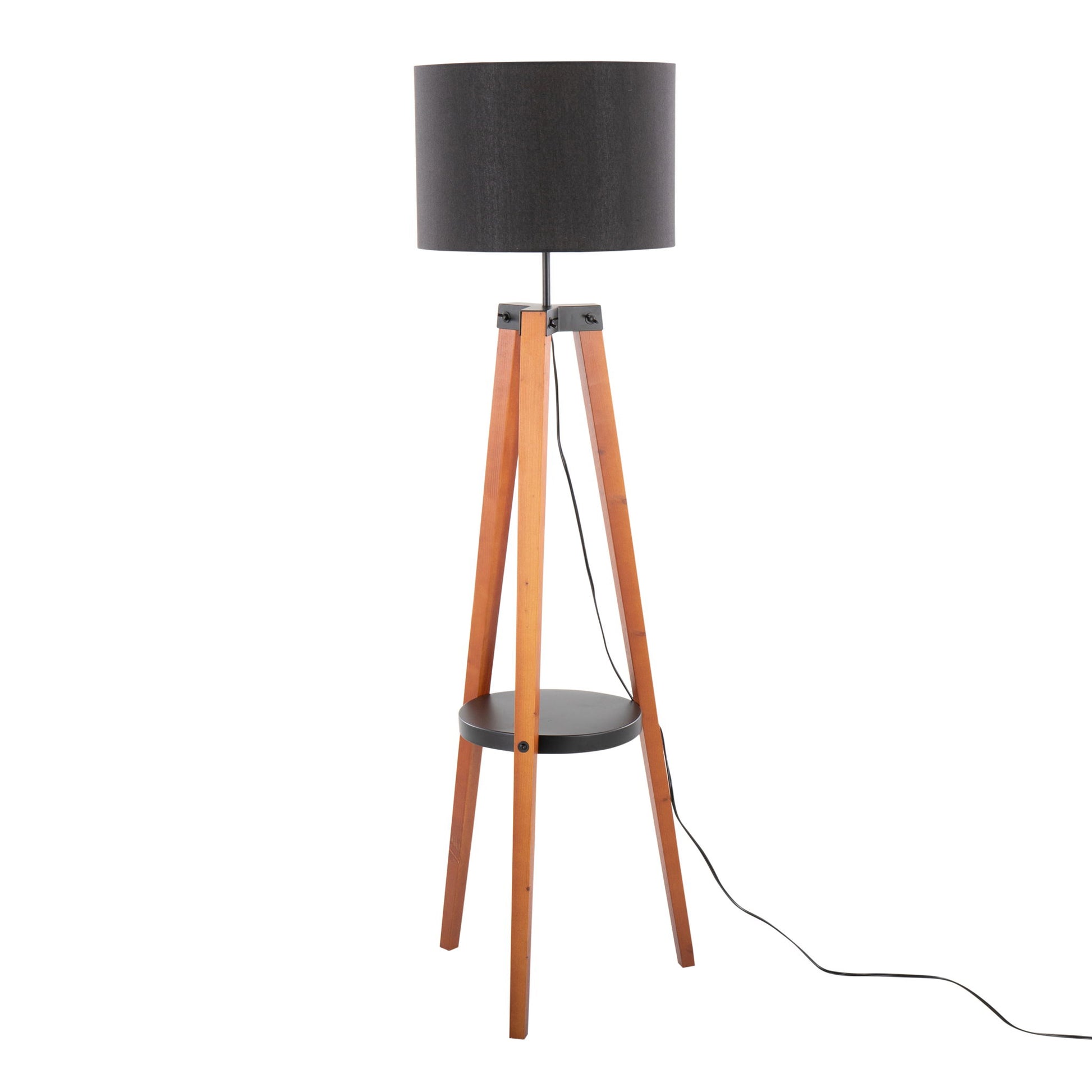 The Compass Mid Century Modern Floor Lamp features a black cylindrical shade, wooden tripod legs, a small round black shelf, and a visible black power cord.