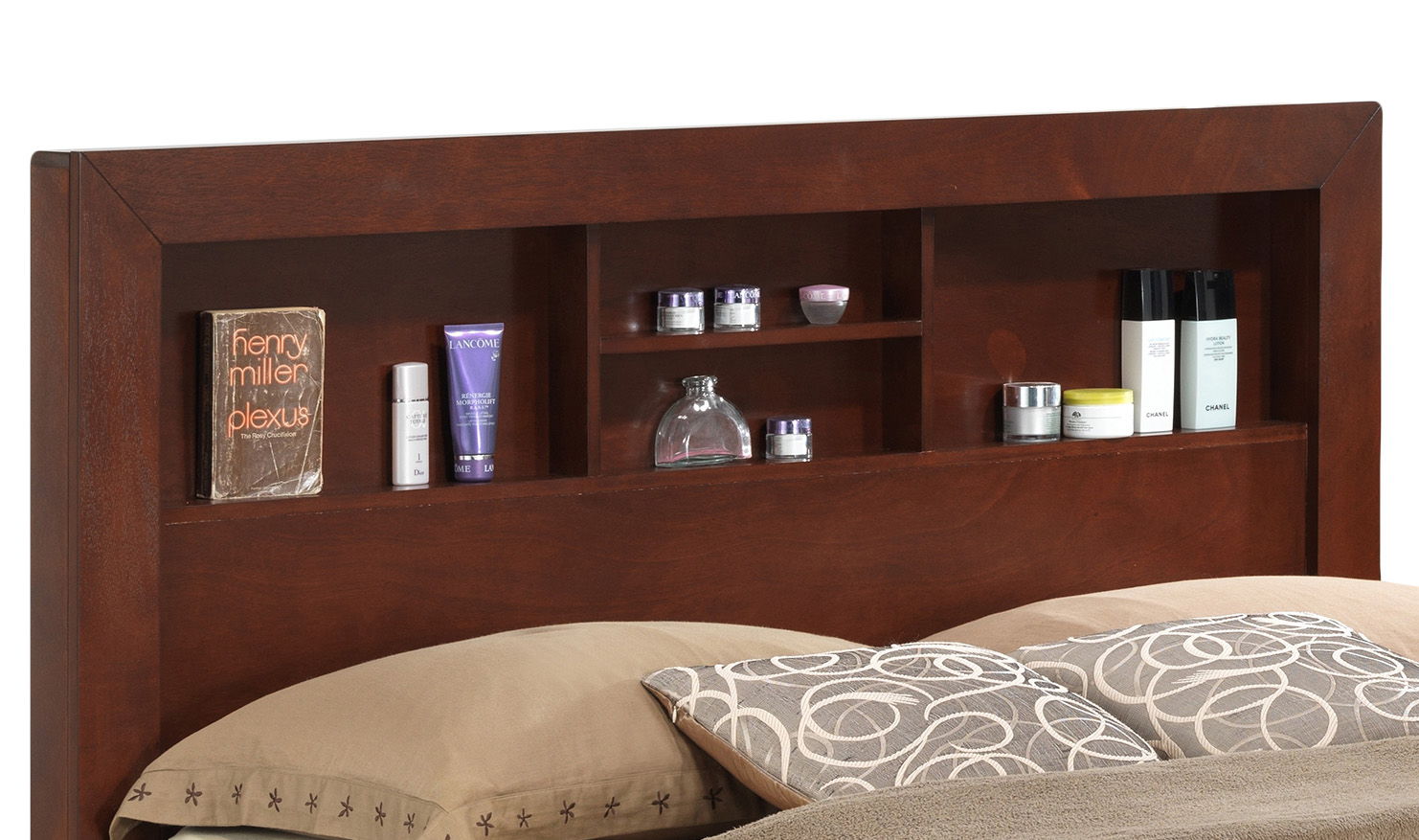 The Stylish Storage Bed For Modern Spaces features a wooden headboard with built-in shelves for books and essentials, while the bed below is dressed in beige pillows with circular patterns and a matching beige blanket.