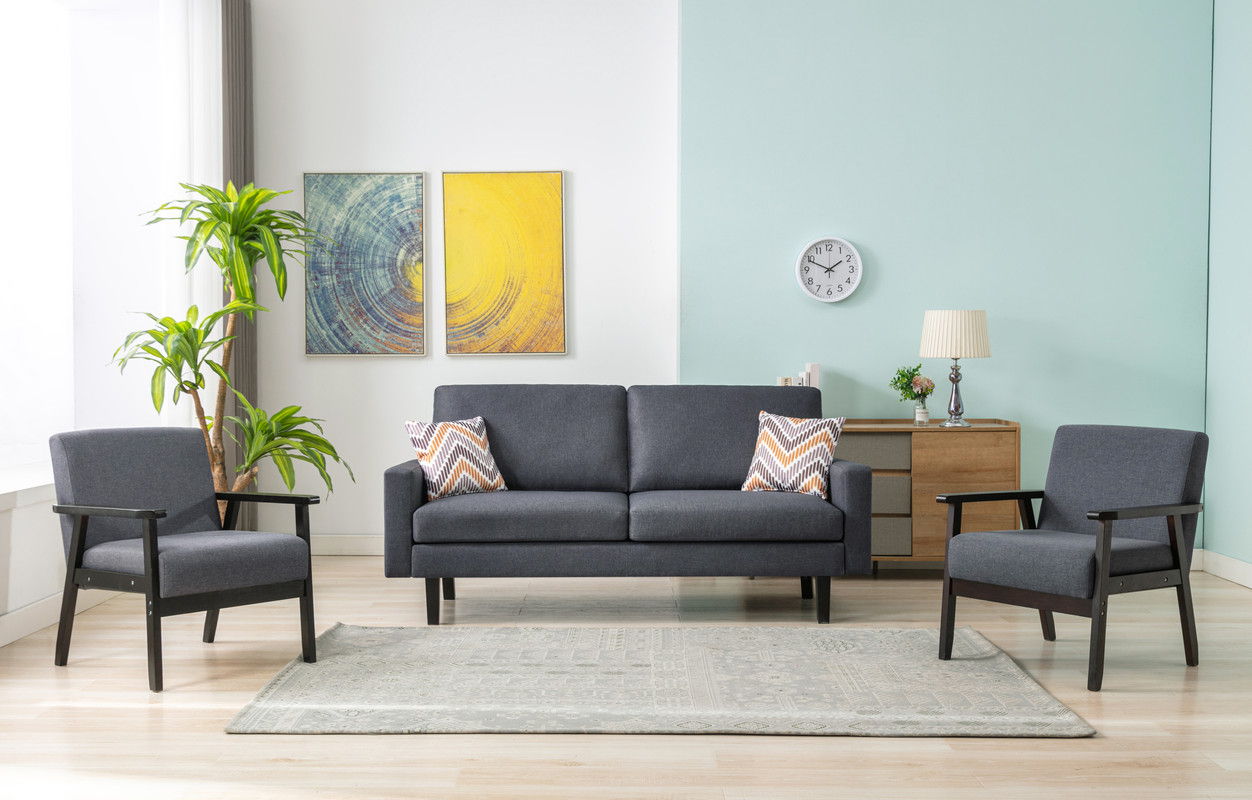 Modern living room featuring the Bahamas Sofa Set with 2 throw pillows, matching gray seating, potted plant, stylish sideboard with lamp and clock, abstract wall art, light wood flooring, and a textured rug.