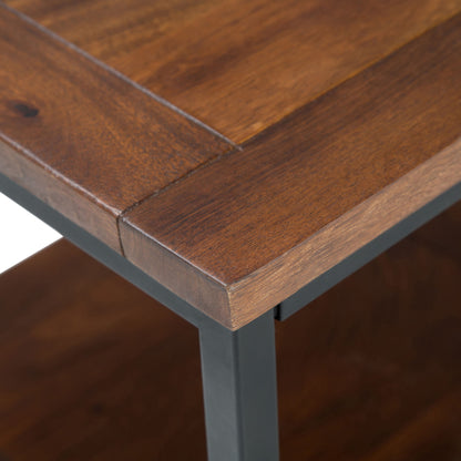 Close-up of the Skyler - Handcrafted Table's corner, featuring wood grain and joint details on its dark brown wooden top and black metal frame.
