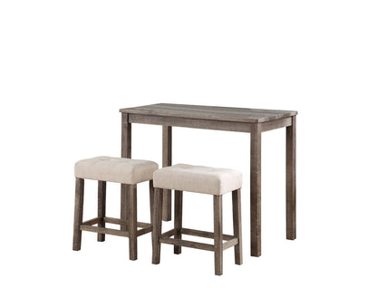 The Lux 3 Piece Counter Height Pub Table set features a wooden table with a rustic finish and two matching tufted linen upholstered stools in beige, neatly tucked under the table.