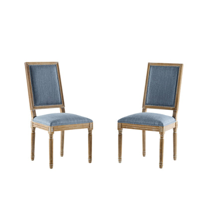 Two French Country Style Dining Chairs with blue upholstered seats and backs, featuring fluted legs and a classic design, are shown on a white background.