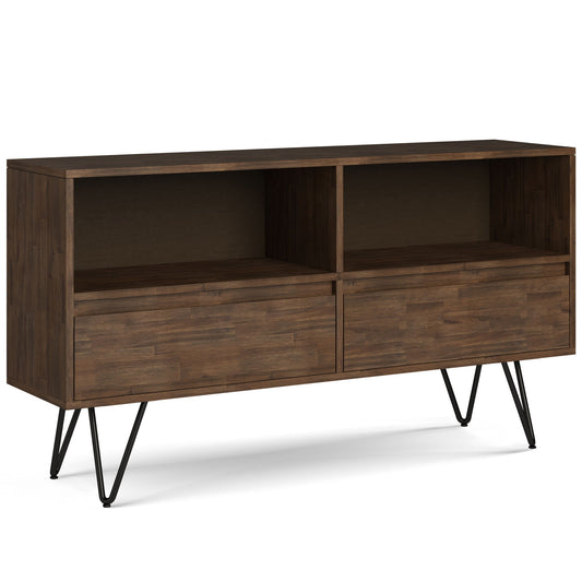 The Chase Low Bookcase features a rustic natural aged brown finish, two open upper shelves, and two closed drawers below. It stands on sleek black metal hairpin legs for a modern touch.