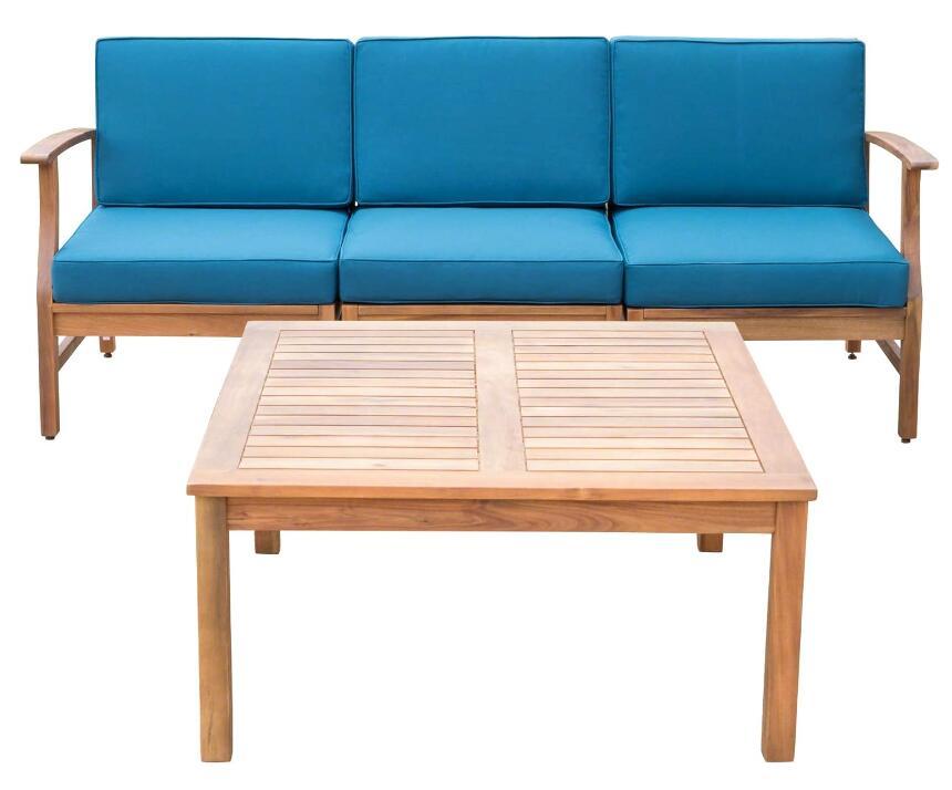 The Perla - 3 Seater Sofa And Table Set includes a wooden outdoor sofa with blue cushions and a matching slatted-top coffee table, both featuring a simple, modern design.