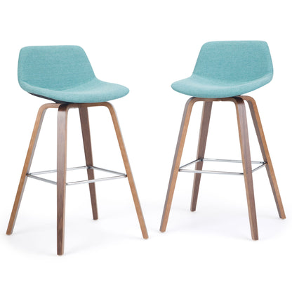 The Randolph Bentwood Counter/Bar Height Stool (Set of 2) features curved backs, light teal upholstered seats, wooden legs, and metal footrests in a contemporary design, shown against a plain white background.