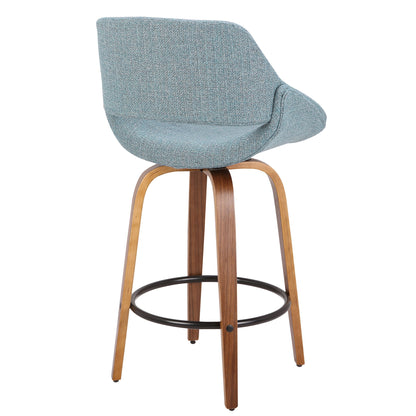 The Fabrico - Mid Century Inviting Design Modern Counter Stool features a light blue upholstered seat and backrest, curved wooden legs, and a black circular metal footrest, shown from the back.