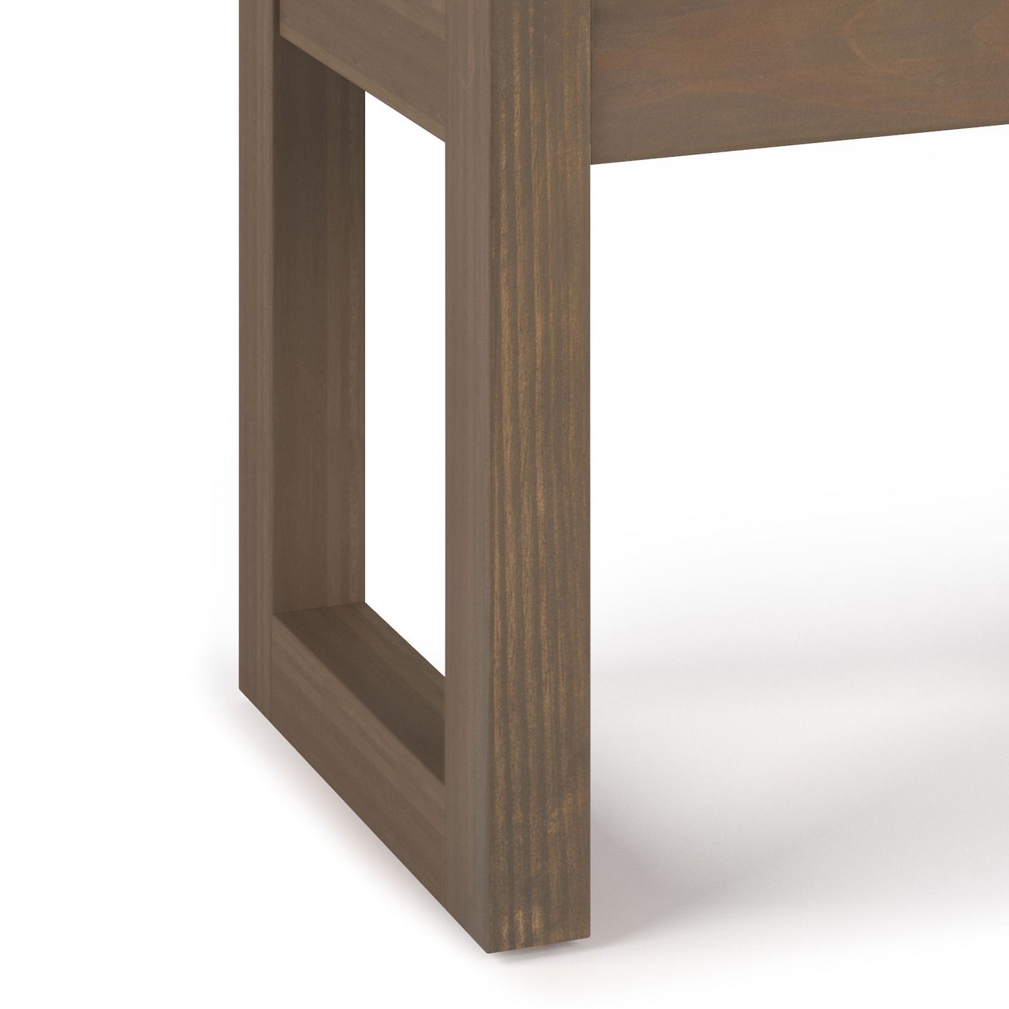 Close-up of the corner leg of the Milltown - Upholstered Ottoman Bench, showcasing its rectangular open-frame design and smooth brown wood finish against a white background.