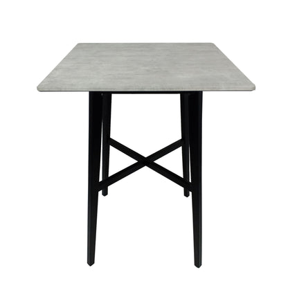 The Modern Bar Height Dining Table features a gray laminate tabletop with black, angled rubberwood legs joined by a crisscross support.
