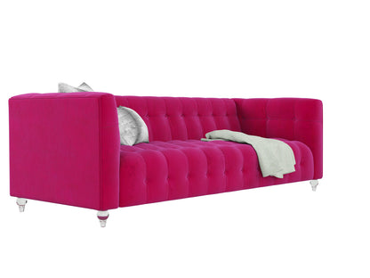 The Bea Velvet Tufted Sofa is a stylish and modern piece featuring a pink velvet design, elegant tufted upholstery, and clear legs. It is accessorized with a gray pillow and has a light green throw draped over one side, all set against a white background.
