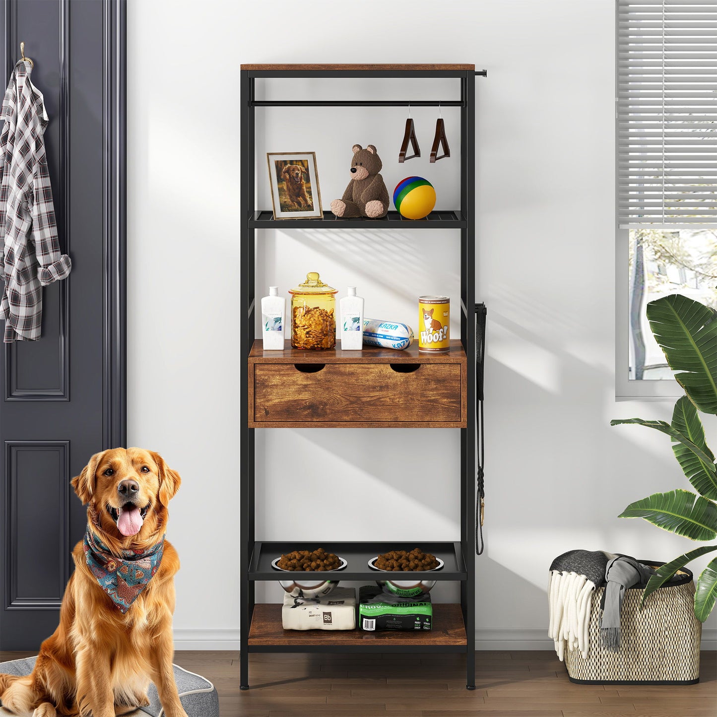 A black/dark brown Dog Feeding Station with 3 height-adjustable raised bowls and storage shelves holds pet supplies, toys, treats, and decor. A golden retriever sits in front; a laundry basket, plant, and shirt are nearby in a bright room.