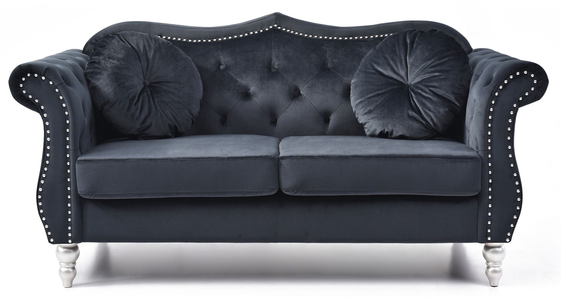 The Stylish Flared Arm Loveseat features a dark velvet finish, silver stud trim, tufted back, two round pillows, and silver legs, shown against a white background.