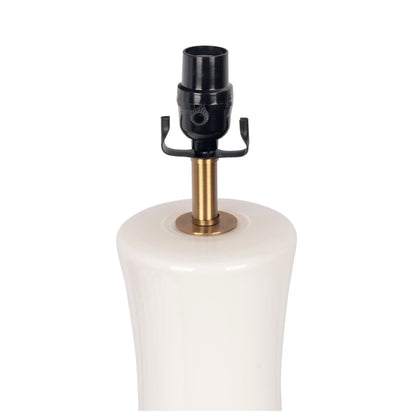 Close-up of the Cascade Lamp Base Table Lamp in beige, gold, and white, showing its ceramic base with a brass neck and black socket against a white background.