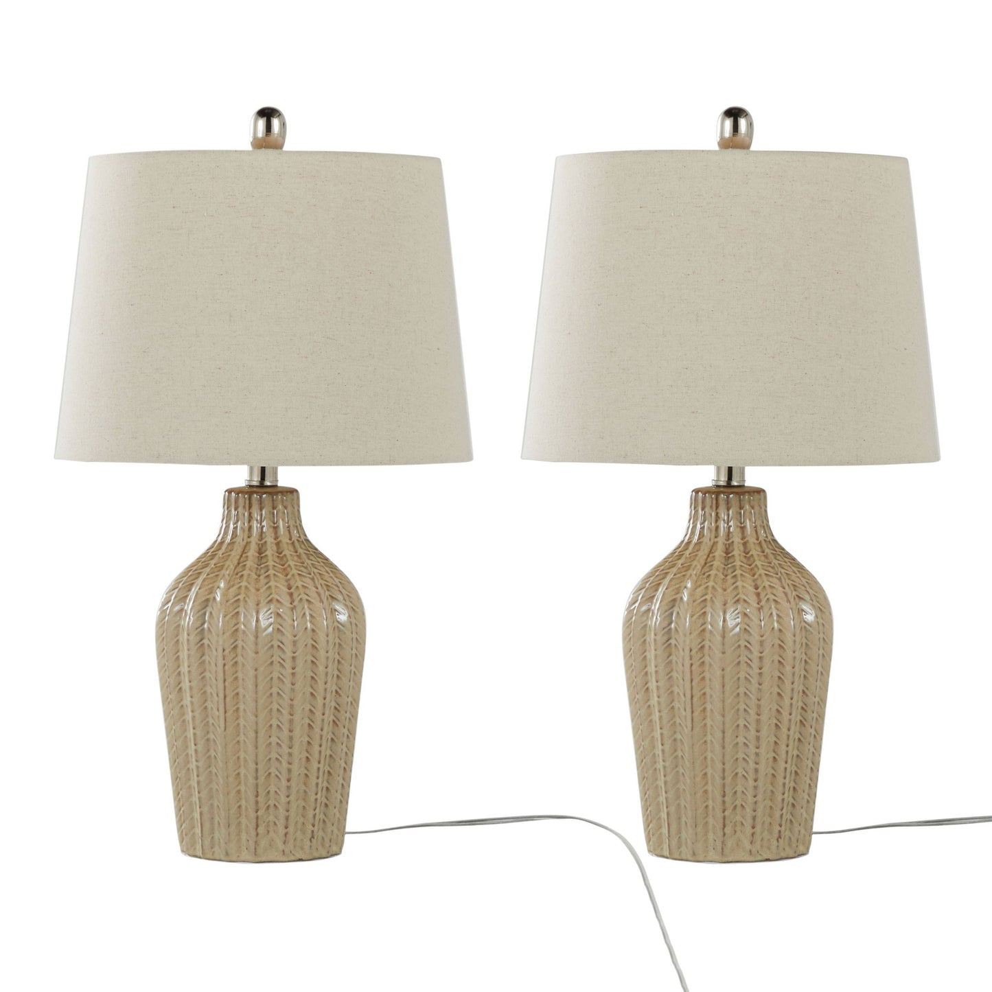The Rockwell - Contemporary Table Lamp (Set of 2) features beige ceramic bases with a ribbed texture and white fabric drum shades. Both lamps are plugged in, showcasing their modern design with visible power cords.