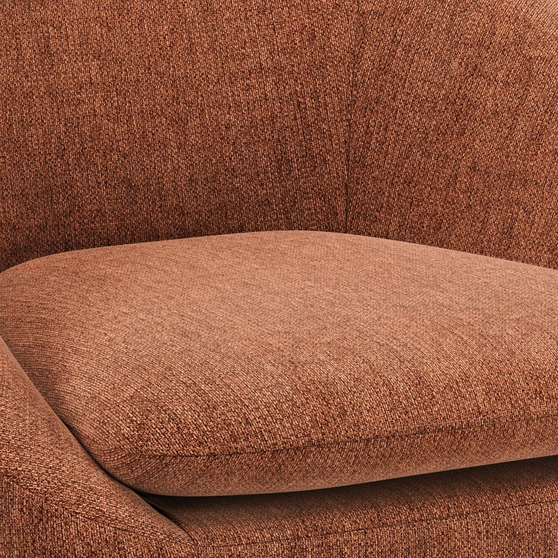 Close-up of the Redding - Upholstered Accent Chair in rust-colored textured fabric, highlighting the cushioned seat, backrest, and part of the armrest.