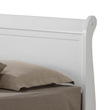 A close-up of the Elegant Trundle Bed With Timeless Charm showcases its white wooden headboard with a curved top, panel detailing, and smooth finish, paired with beige bedding and pillow for a classic look.