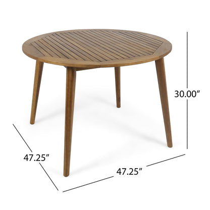The Stamford Outdoor Dining Table features a modern round wooden design with a slatted top, four angled legs, and measures 47.25" W x 47.25" D x 30" H.