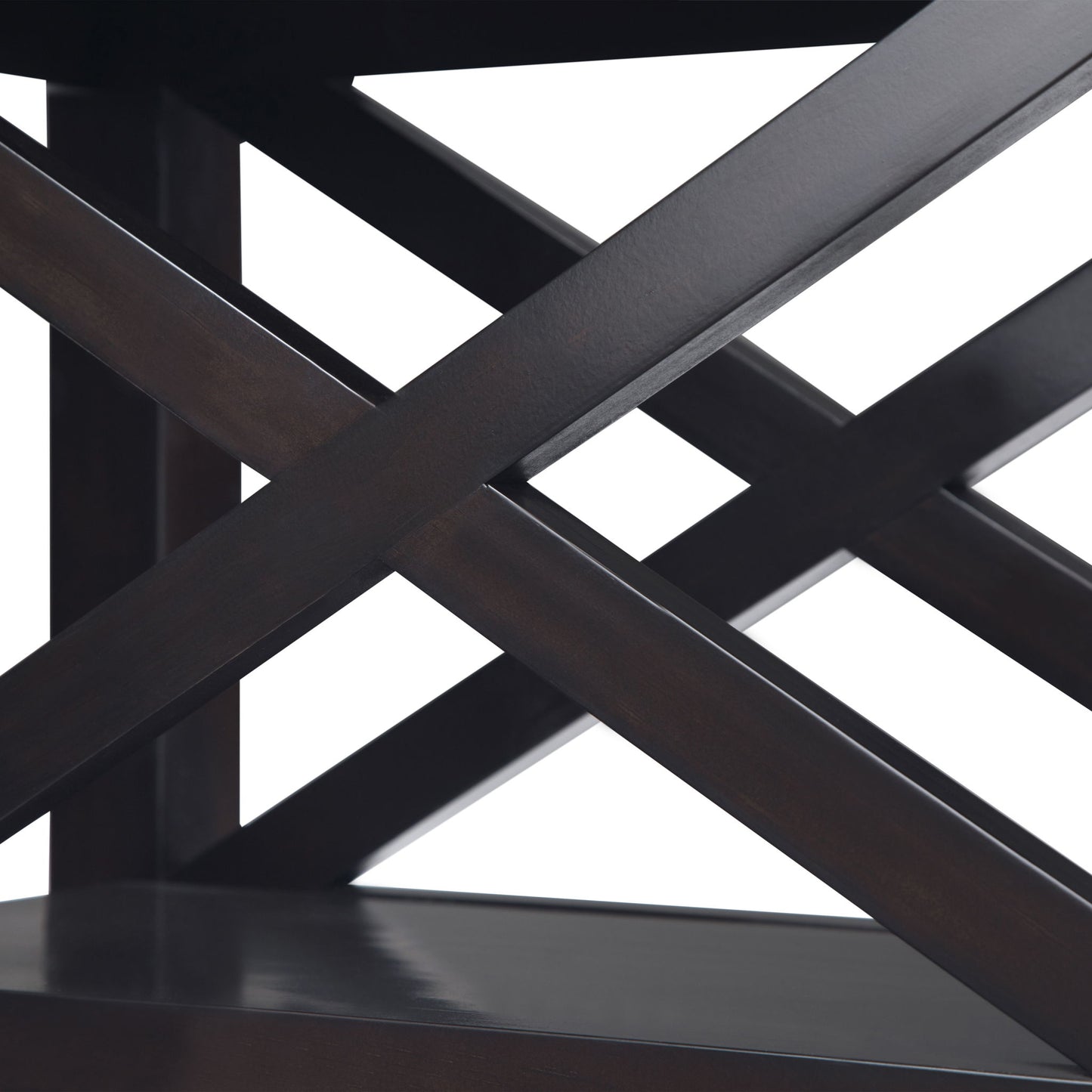 Close-up of the Kitchener - Handcrafted Table featuring dark wooden shelves with intersecting diagonal support beams in an X-shape. The white background highlights the table’s glossy finish and geometric design.