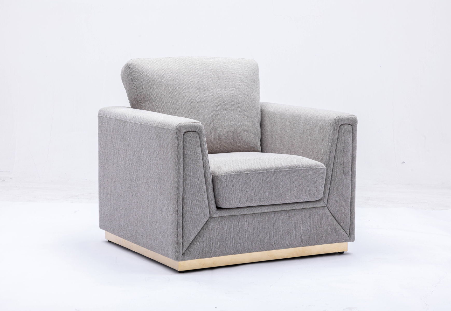 The Couch.com Valin Linen Chair features a modern, square design with wide armrests and cushioned seat and backrest in gray fabric. Its wooden base adds style, making it a perfect contemporary addition to any living room.