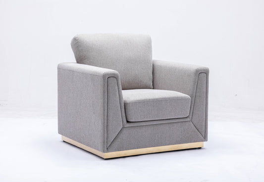 The Couch.com Valin Linen Chair features a modern, square design with wide armrests and cushioned seat and backrest in gray fabric. Its wooden base adds style, making it a perfect contemporary addition to any living room.