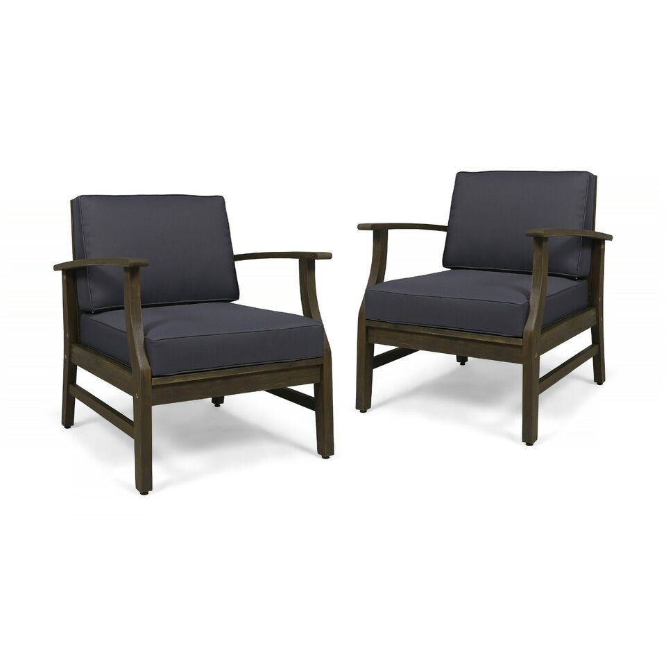 Two Perla Contemporary Club Chairs with water-resistant dark gray cushions and wooden frames, positioned side by side on a white background.