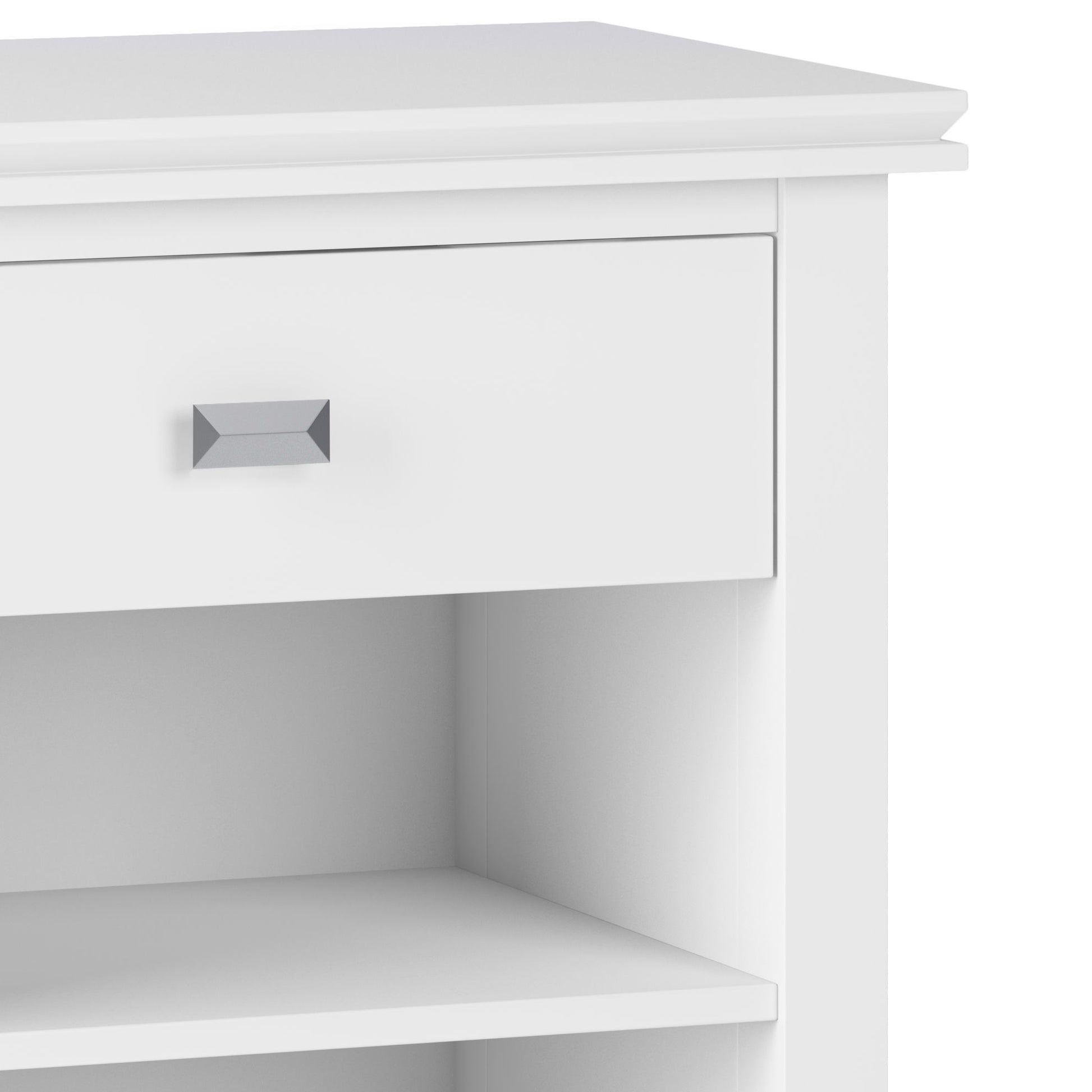Close-up of the Artisan - Handcrafted Bedside Table, a white cabinet with a single drawer featuring a rectangular metallic handle and an open shelf below.