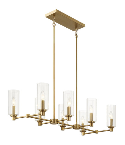 The Willow - 8 Lights Island features a rectangular antique brass base with six cylindrical clear ribbed glass shades in two rows, each holding a candle-style bulb and suspended by gold rods.