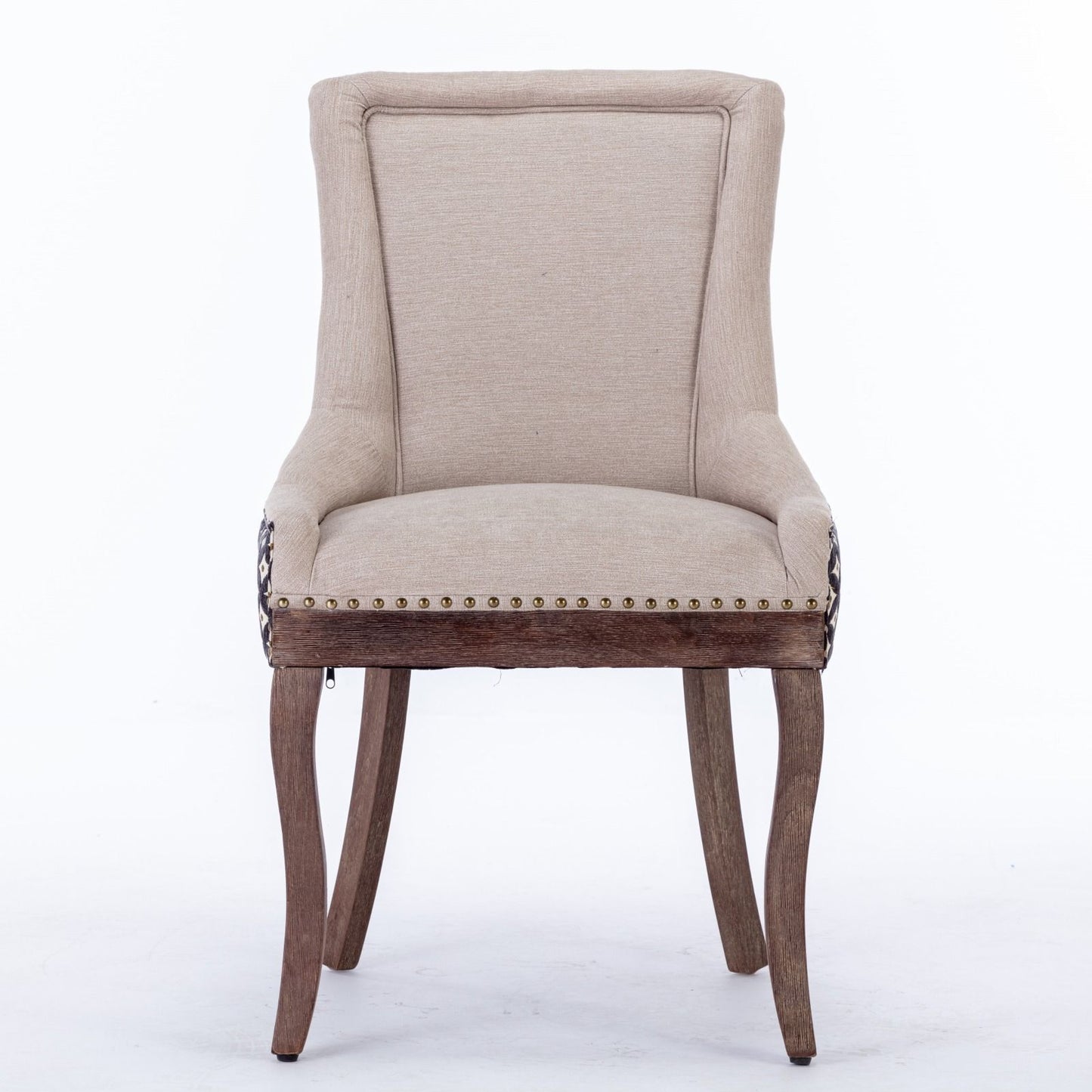 The Ultra Side Dining Chair set features thickened beige fabric, a tall curved backrest, bronze nailhead trim, and neutrally toned solid wood legs, shown here against a white background.