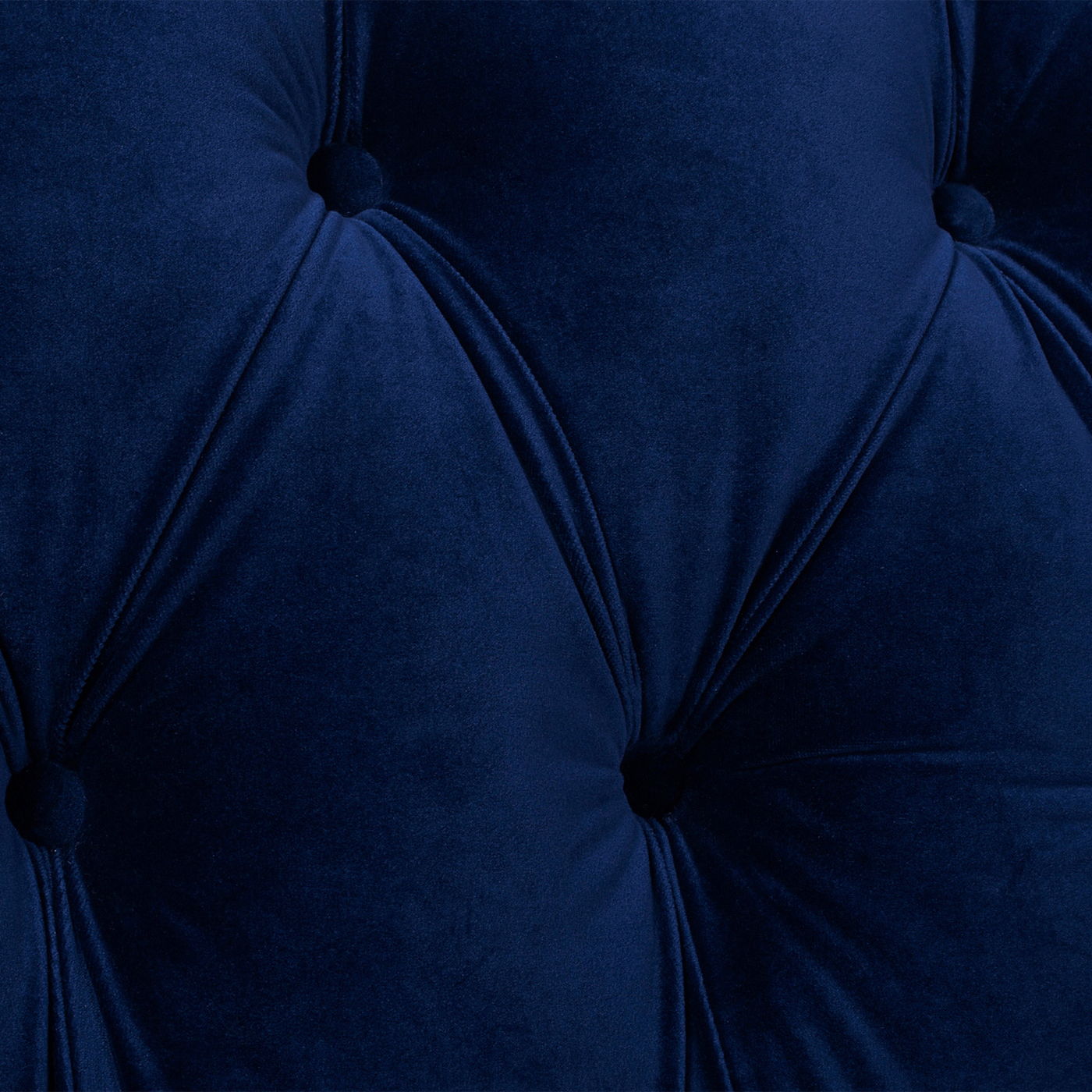 Close-up of the La Rosa - Victorian Chesterfield Tufted Sofa, showcasing deep blue velvet fabric with a plush texture, buttoned indents, and diagonal stitching that forms an elegant diamond pattern.