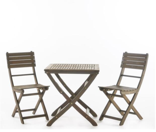 The Positano - Foldable Dining Set, featuring two brown wooden folding chairs and a matching square table with a simple slatted design, is arranged on a plain white background. Suitable for both indoor and outdoor use.